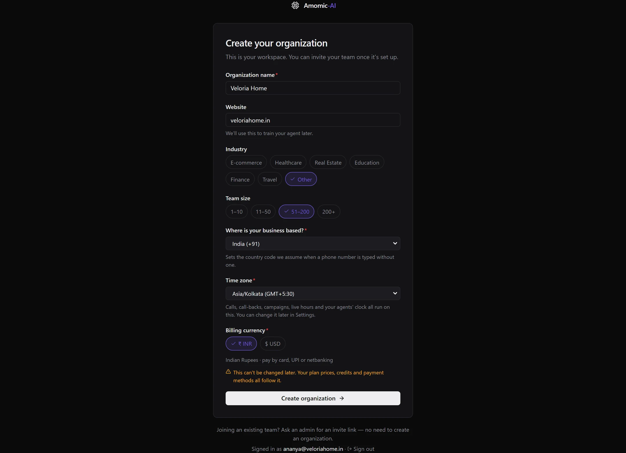The Create your organization form filled in for Veloria Home: website, industry Other, team size 51–200, India (+91), Asia/Kolkata, and Billing currency ₹ INR with a warning that it can't be changed later