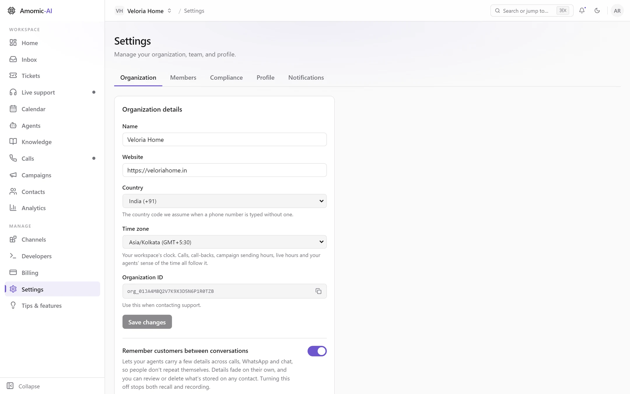 The Organization tab: Name Veloria Home, Website, Country India (+91), Time zone Asia/Kolkata, Organization ID with a copy button, and the Remember customers between conversations switch