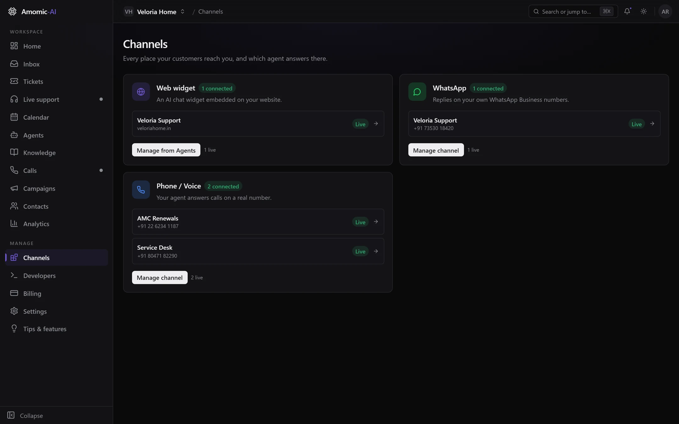The Channels page with three cards: Web widget with Veloria Support live on veloriahome.in, WhatsApp with Veloria Support live on +91 73530 18420, and Phone / Voice with AMC Renewals and Service Desk live on two numbers